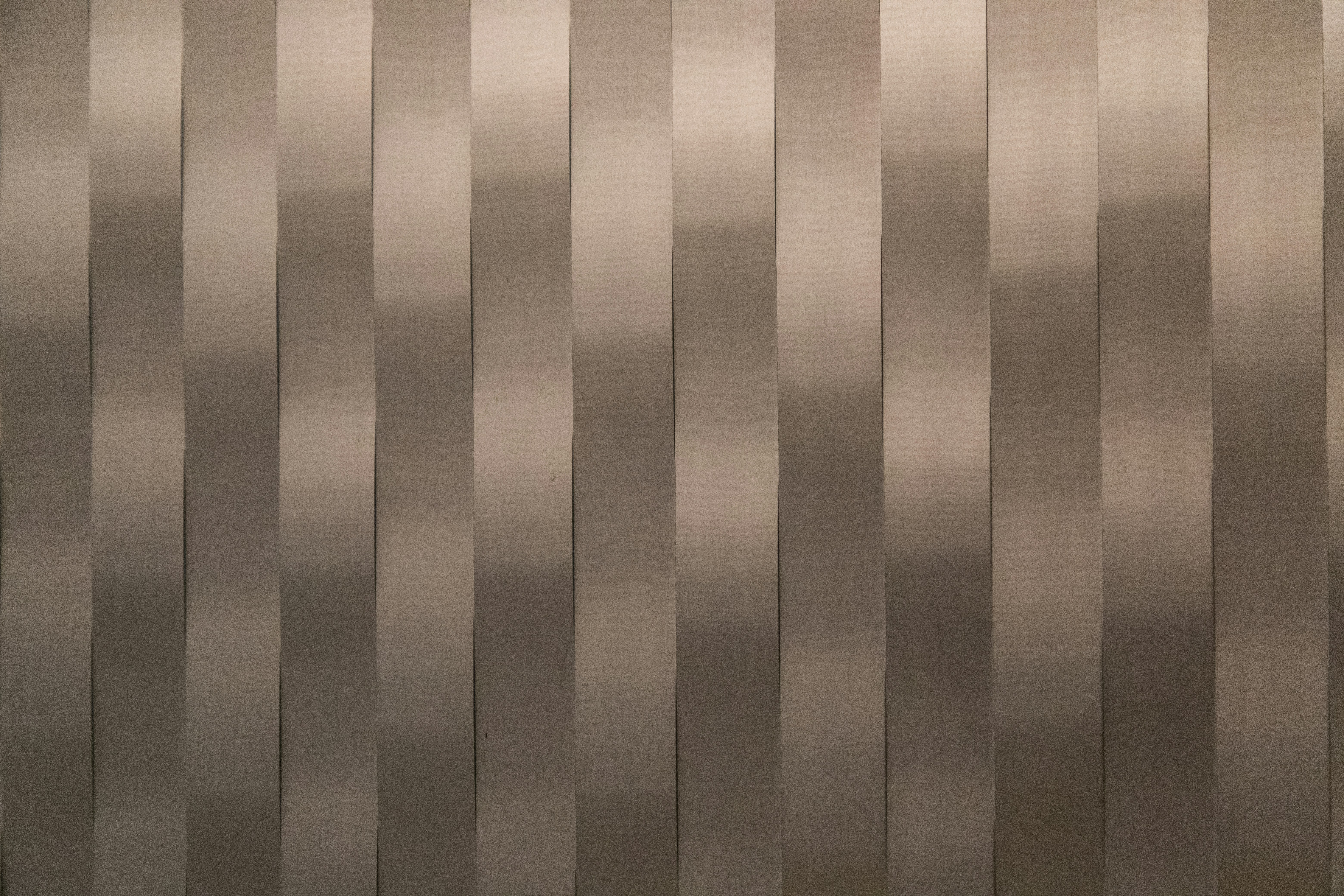 a close up of a wall made of metal strips